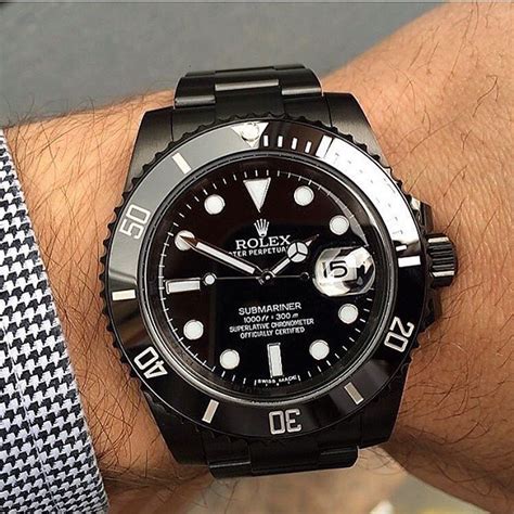 gold rolex with black band|all black rolex sub.